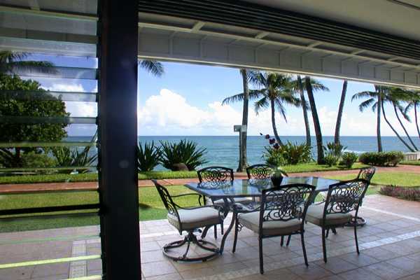 366 Papaloa Road, Unit 1C Kapaa, HI 96746 - Photo 10 of 11 a view of chairs and table in patio with a yard