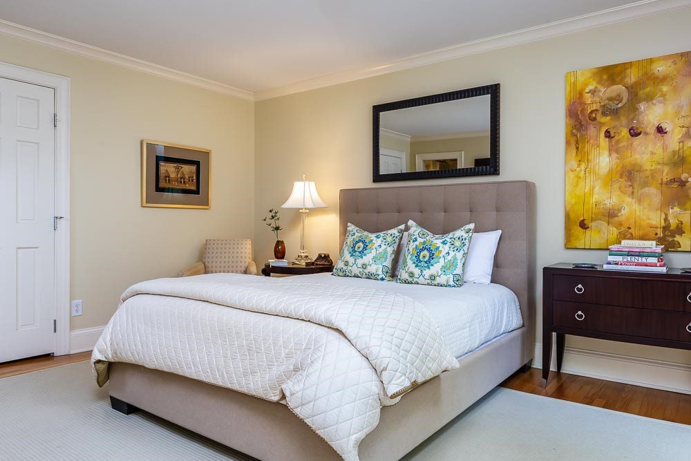 3000 Upland Circle Raleigh, NC 27607 - Photo 16 of 30 a bedroom with a bed and a lamp on dresser