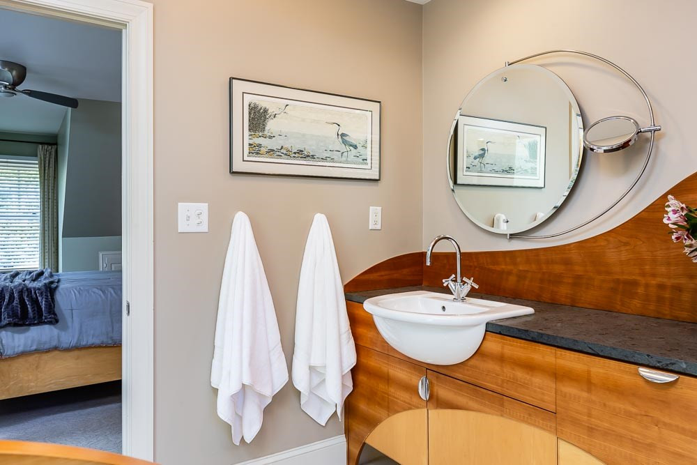 3000 Upland Circle Raleigh, NC 27607 - Photo 20 of 30 a bathroom with a sink and a mirror