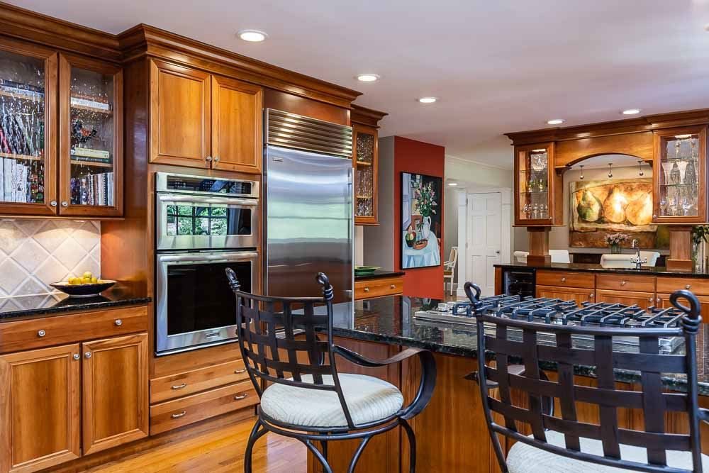 3000 Upland Circle Raleigh, NC 27607 - Photo 6 of 30 a kitchen with stainless steel appliances granite countertop a stove and a refrigerator