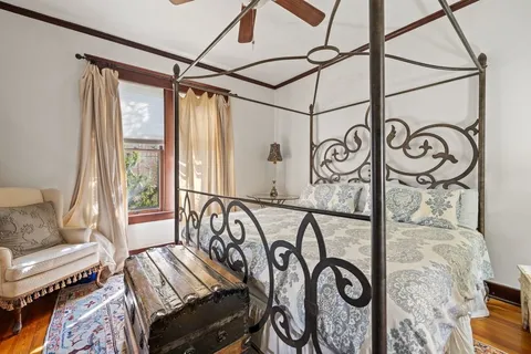 a view of a hallway with couch and wooden floor