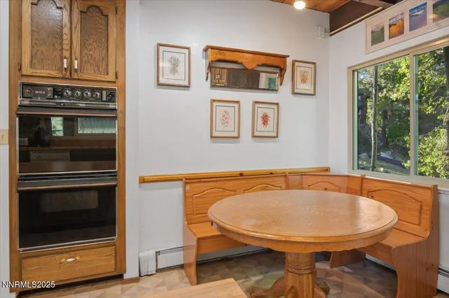 a view of a chairs and table in the patio