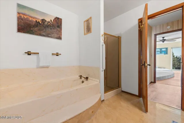 a bathroom with a sink a toilet and a window