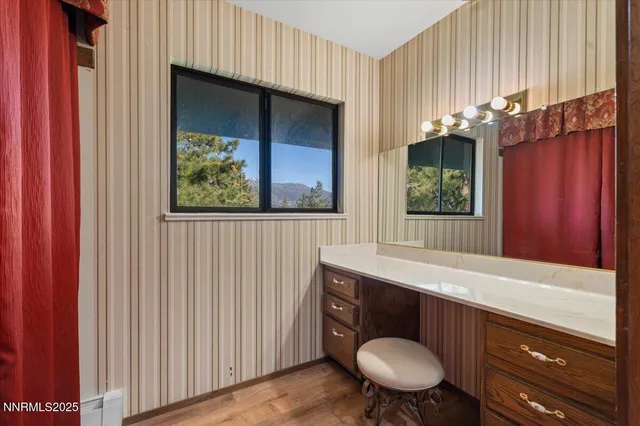 a view of balcony with wooden fence and trees