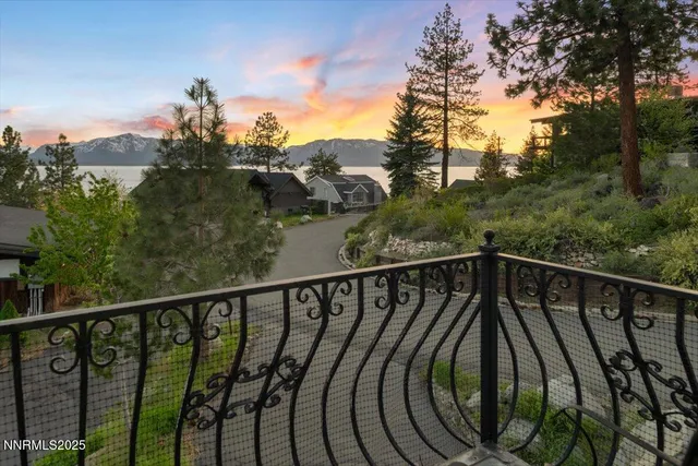 a view of a patio with table and chairs