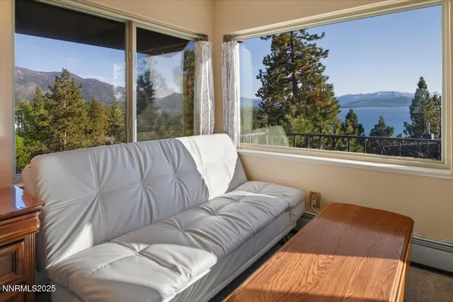 a living room with a large window and a couch