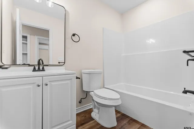 a bathroom with a toilet sink and a bathtub