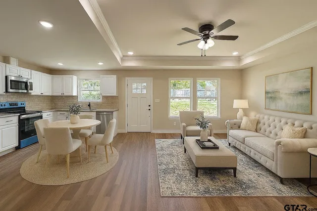a living room with furniture and a large window