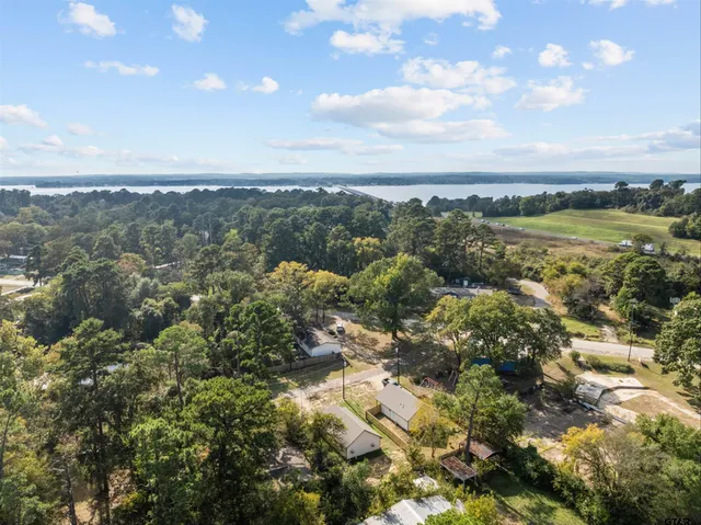 a view of a lake with houses in the back