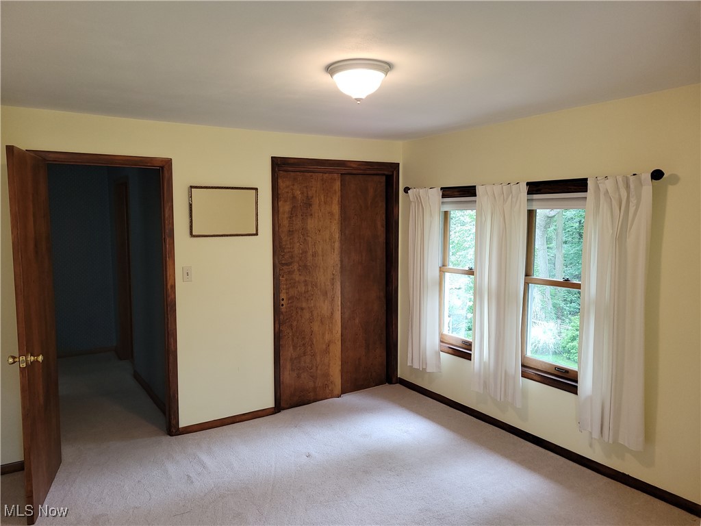 29119 Edgewood Road Bay Village, OH 44140 - Photo 31 of 40 Unfurnished bedroom featuring a closet and light carpet