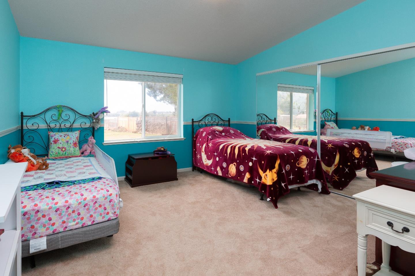 275 Orchard View Drive Watsonville, CA 95076 - Photo 16 of 25 a bedroom with two beds and a dresser next to a window