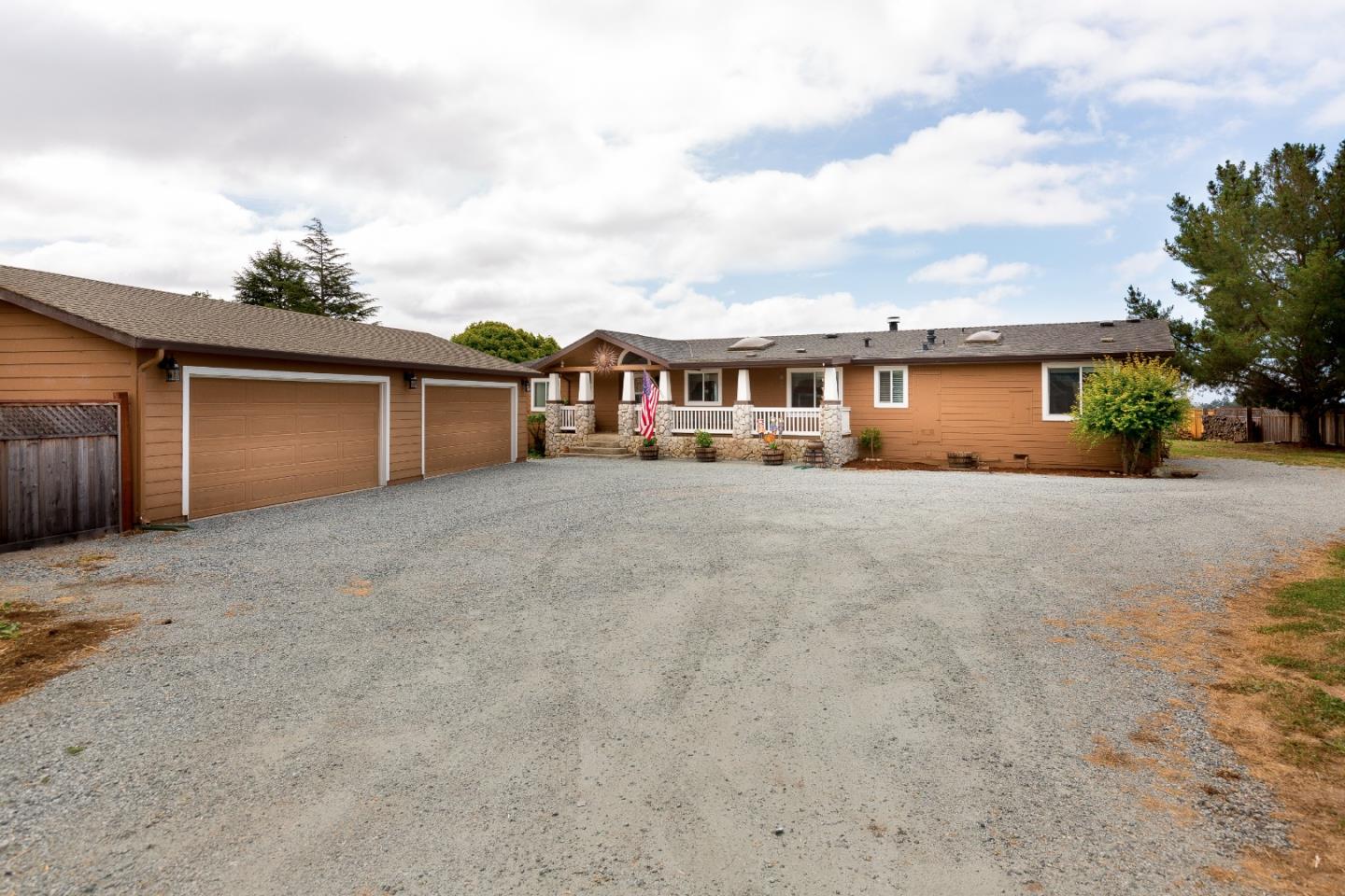 275 Orchard View Drive Watsonville, CA 95076 - Photo 2 of 25 front view of a house with a yard and more windows
