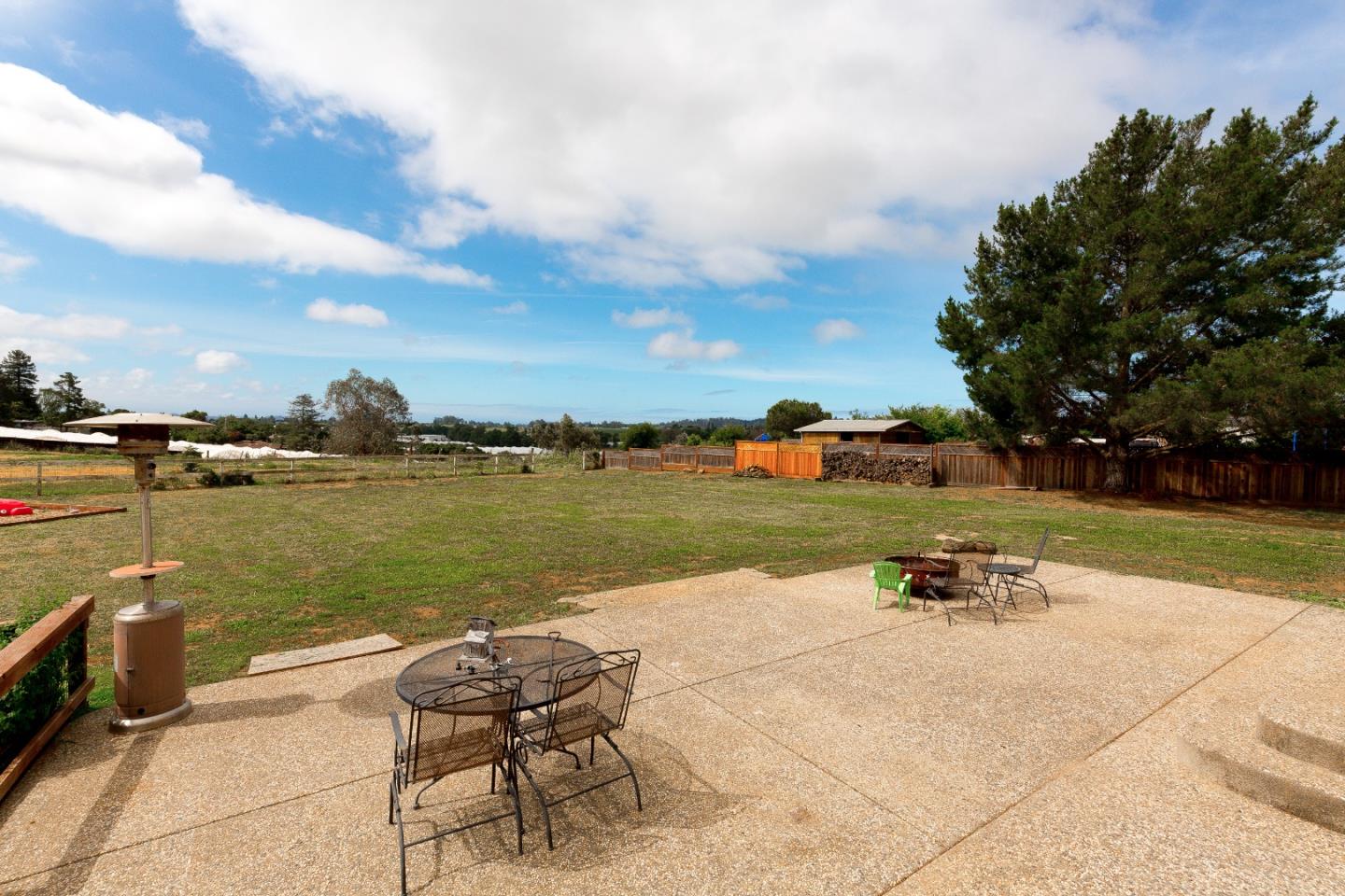 275 Orchard View Drive Watsonville, CA 95076 - Photo 22 of 25 a view of a lake with table and chairs