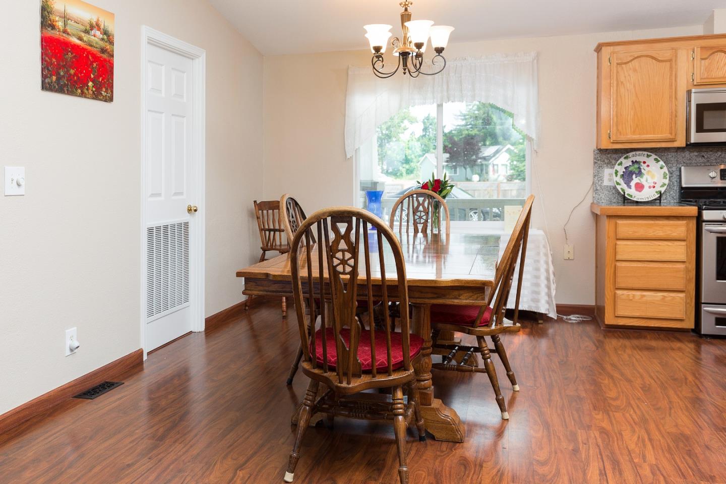275 Orchard View Drive Watsonville, CA 95076 - Photo 9 of 25 a view of a dining room with furniture window and wooden floor