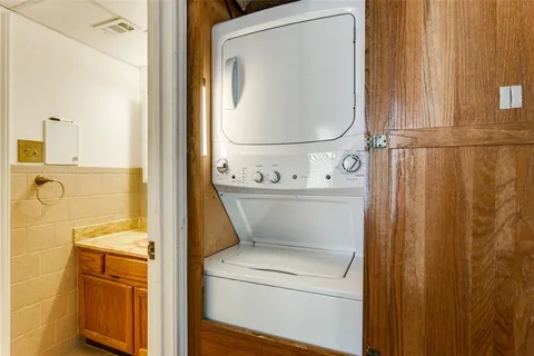 a close view of a utility room with dryer and washer