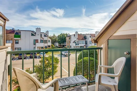 a view of balcony with furniture and city view