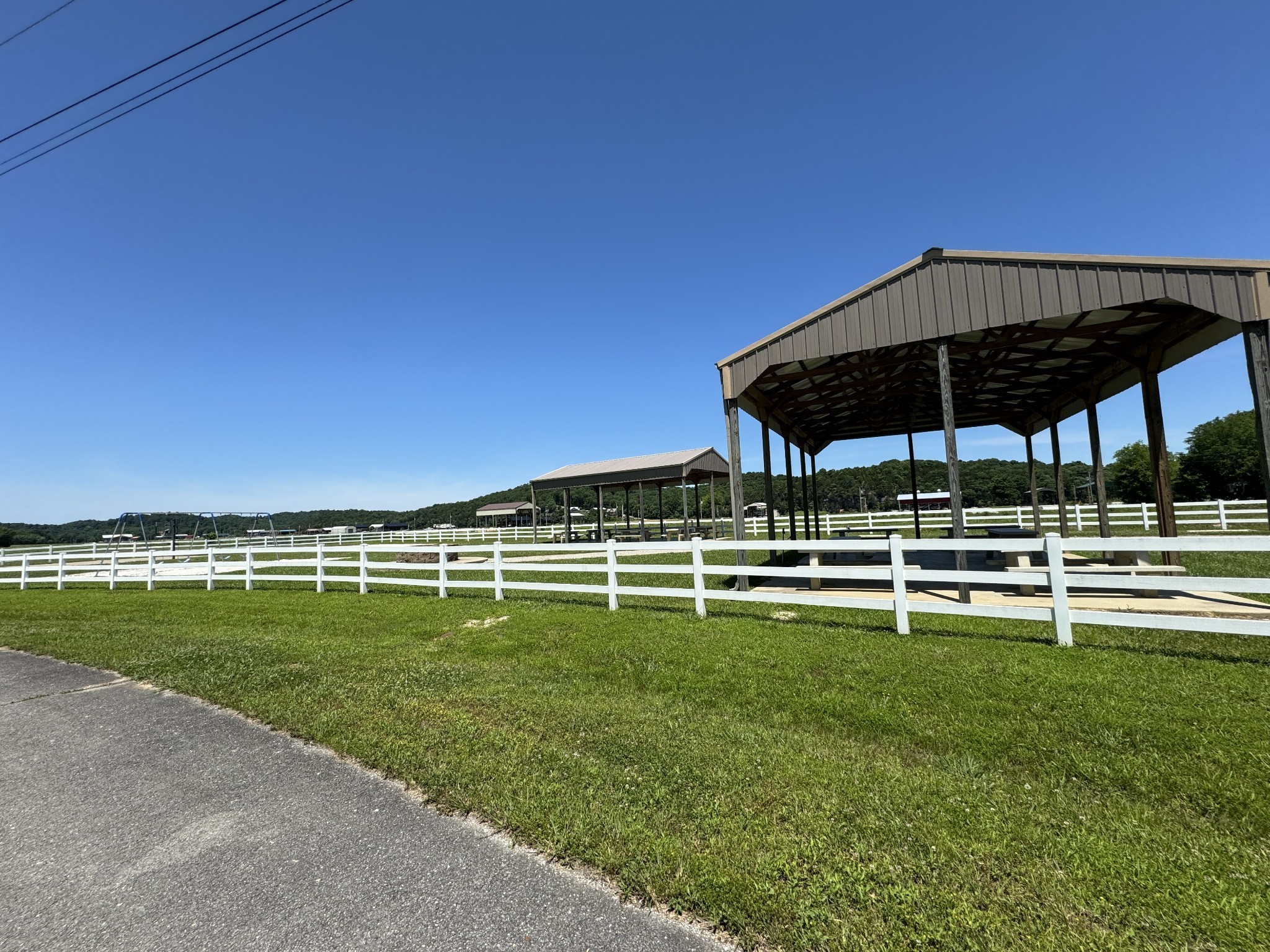 384 Duck Blind Road Clifton, TN 38425 - Photo 6 of 11 a view of a swimming pool with a table and chairs