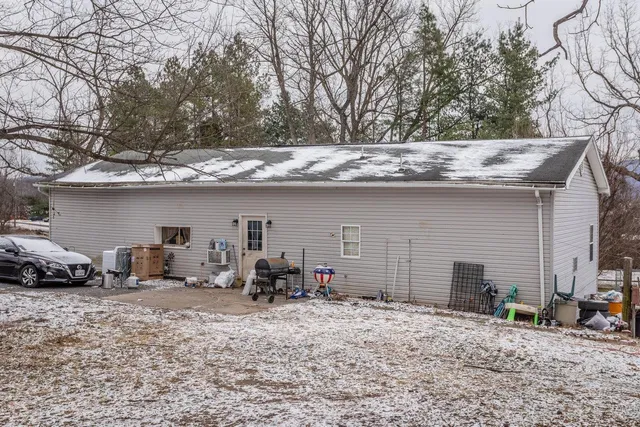 a view of a car parked in front of house