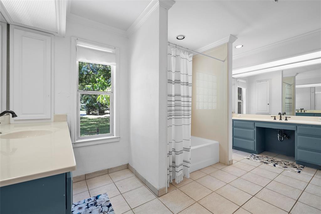1396 Eagle Canyon Drive China Spring, TX 76633 - Photo 28 of 40 Bathroom featuring ornamental molding, tile patterned flooring, vanity, shower / bath combo with shower curtain, and recessed lighting