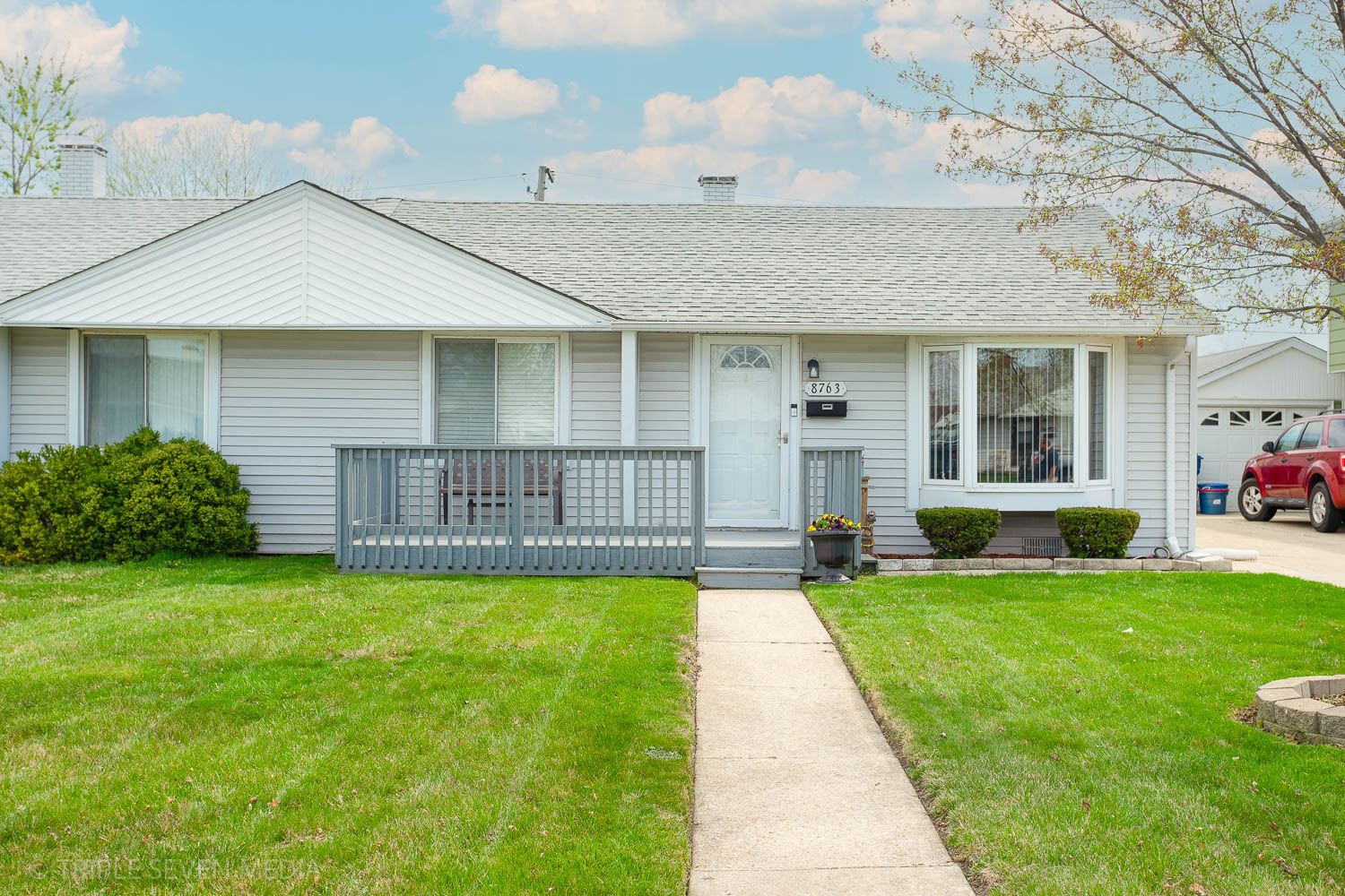 8763 South Corcoran Road Hometown, IL 60456 - Photo 1 of 28 a view of a house with a yard and sitting area