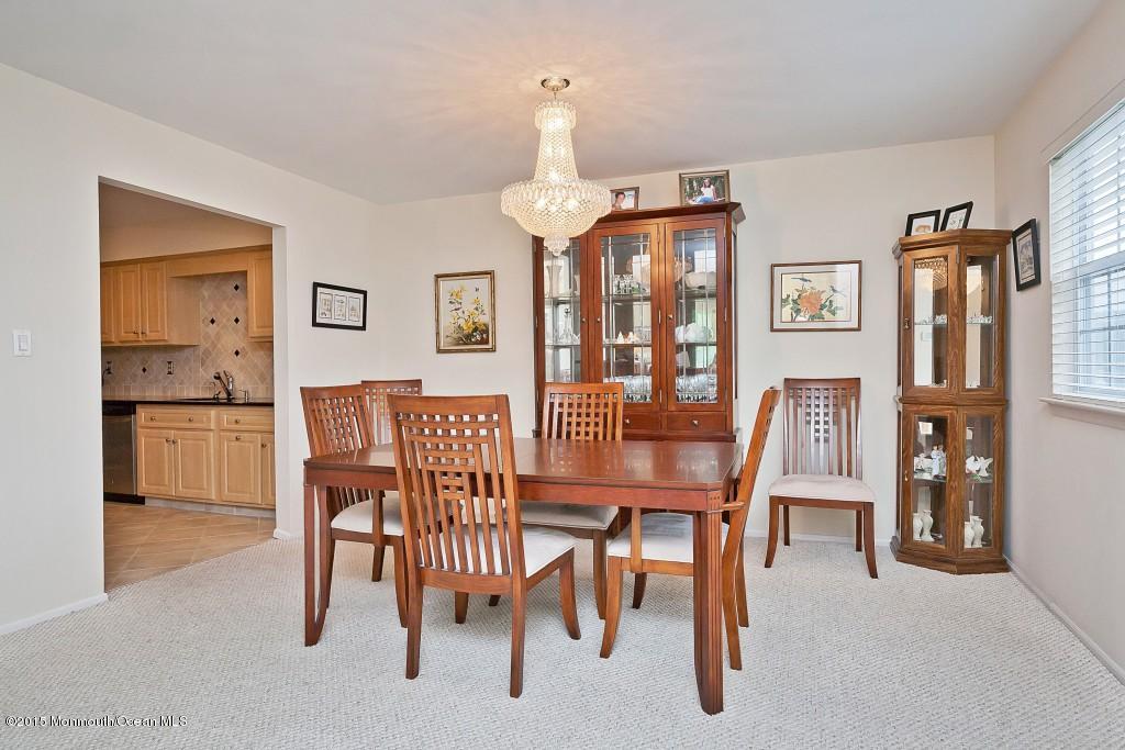 104 Racquet Road Wall, NJ 07719 - Photo 14 of 26 a dining room with furniture and window