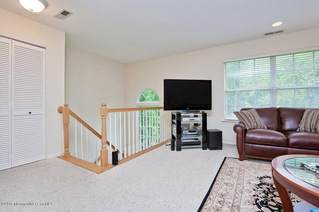 104 Racquet Road Wall, NJ 07719 - Photo 5 of 26 a living room with furniture and a flat screen tv