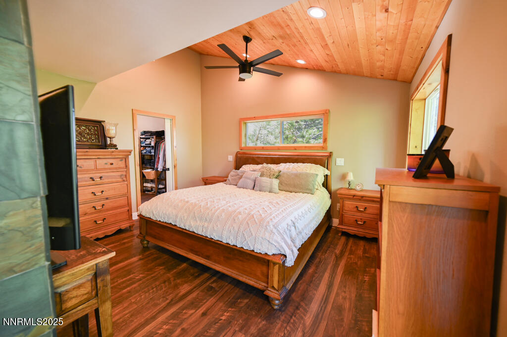 1147 Autumn Hills Road Gardnerville, NV 89460 - Photo 30 of 53 a bedroom with a bed and a flat tv screen on dresser