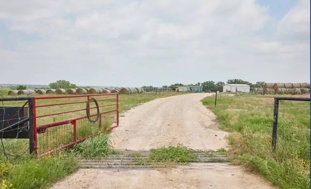 a view of a lake with houses in the back