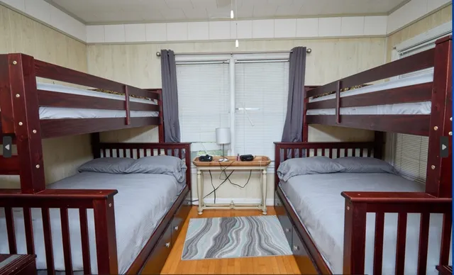 a view of a balcony with furniture and wooden floor