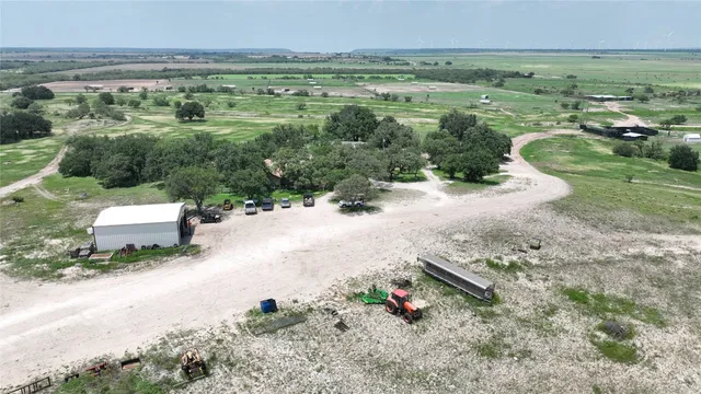 an aerial view of a houses with outdoor space