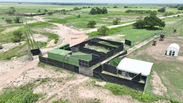 an aerial view of a garden with an outdoor space