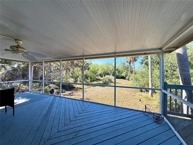 a view of a room with wooden floor and outdoor space
