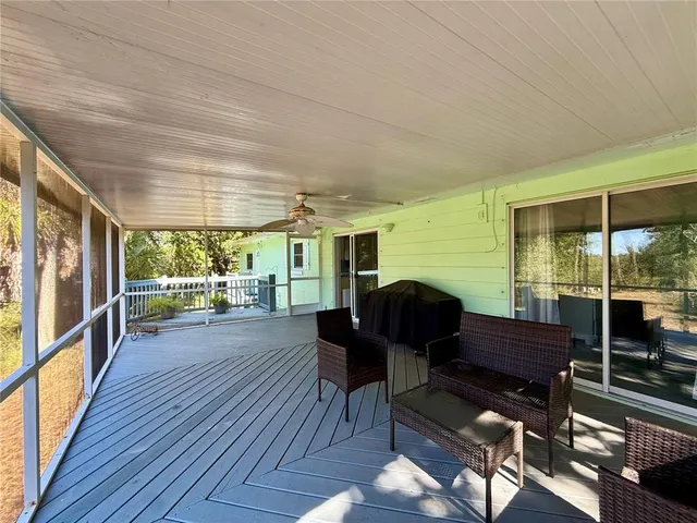 a building outdoor space with wooden floor and outdoor seating