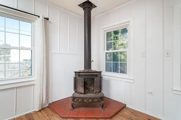 a living room with a fireplace and a window