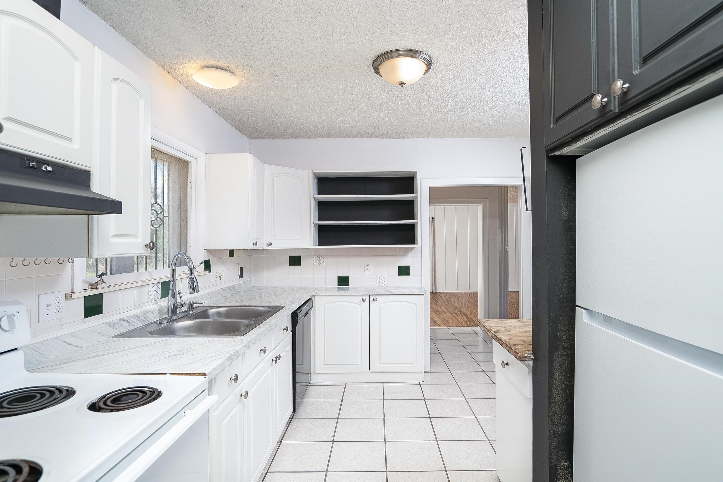 401 Zorayda Avenue St. Augustine, FL 32080 - Photo 16 of 41 a kitchen with stainless steel appliances a stove a sink and a refrigerator