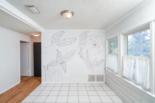 a kitchen with a refrigerator and a sink