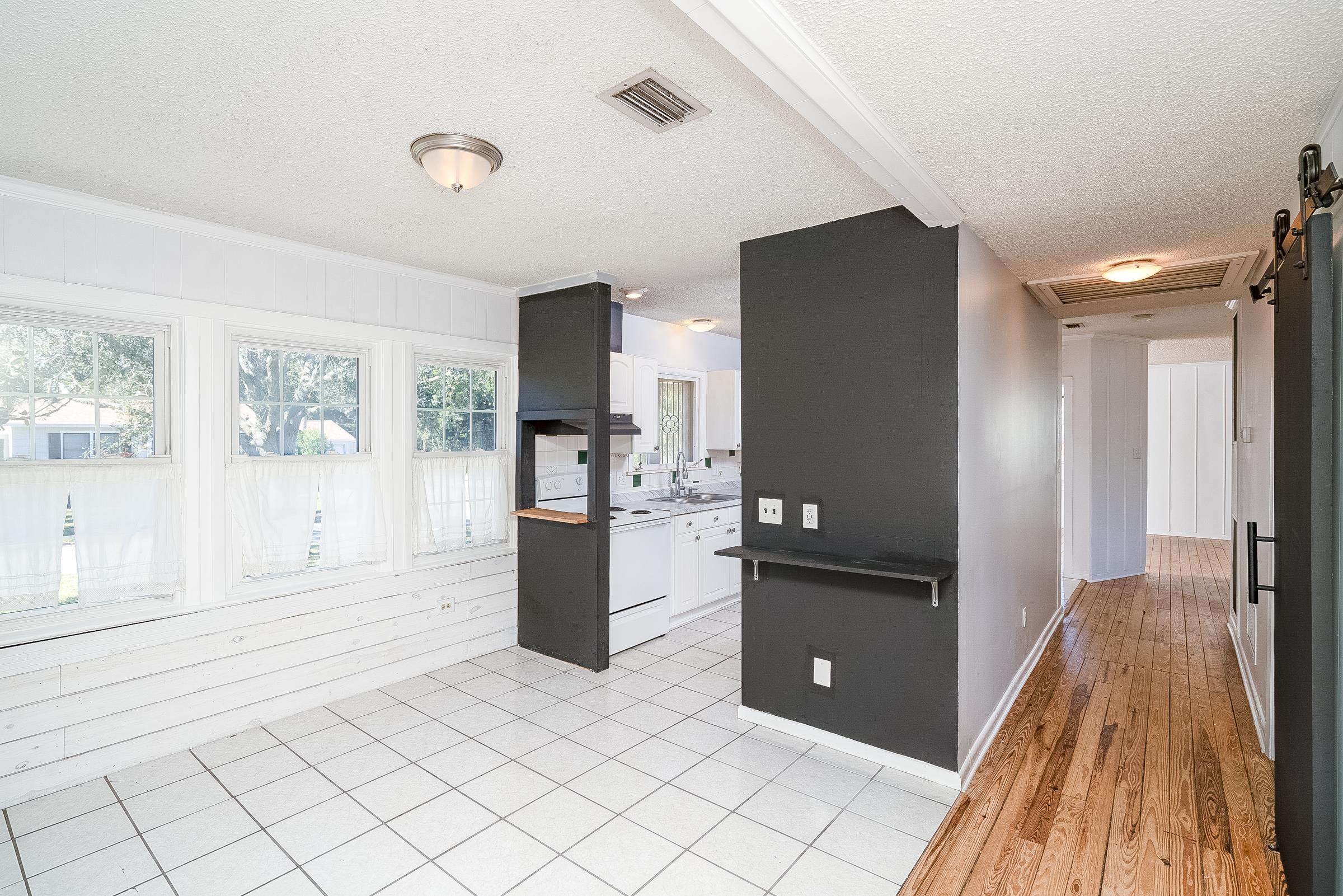 401 Zorayda Avenue St. Augustine, FL 32080 - Photo 18 of 41 a kitchen with a refrigerator and a sink