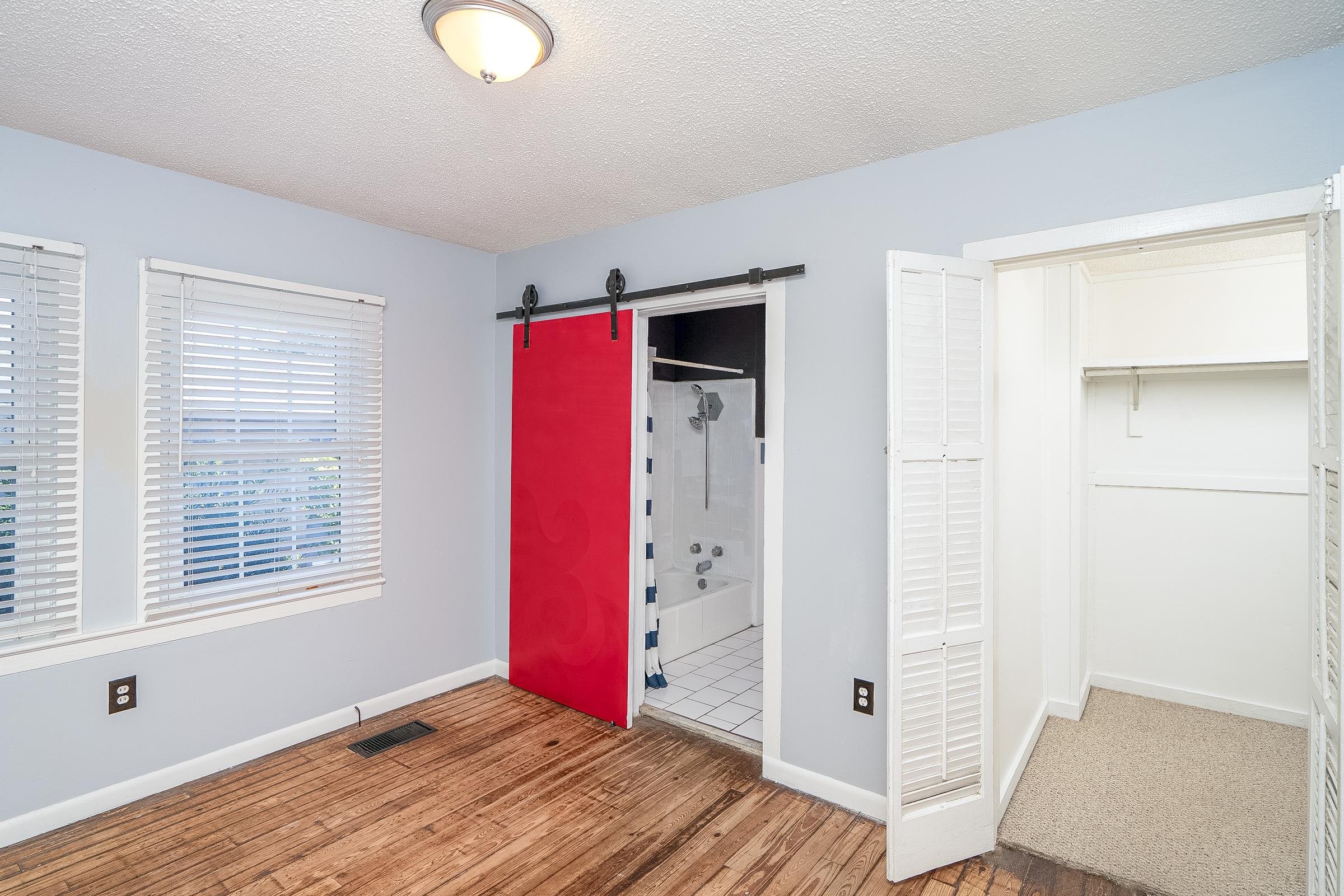 401 Zorayda Avenue St. Augustine, FL 32080 - Photo 24 of 41 a view of an empty room with window and wooden floor