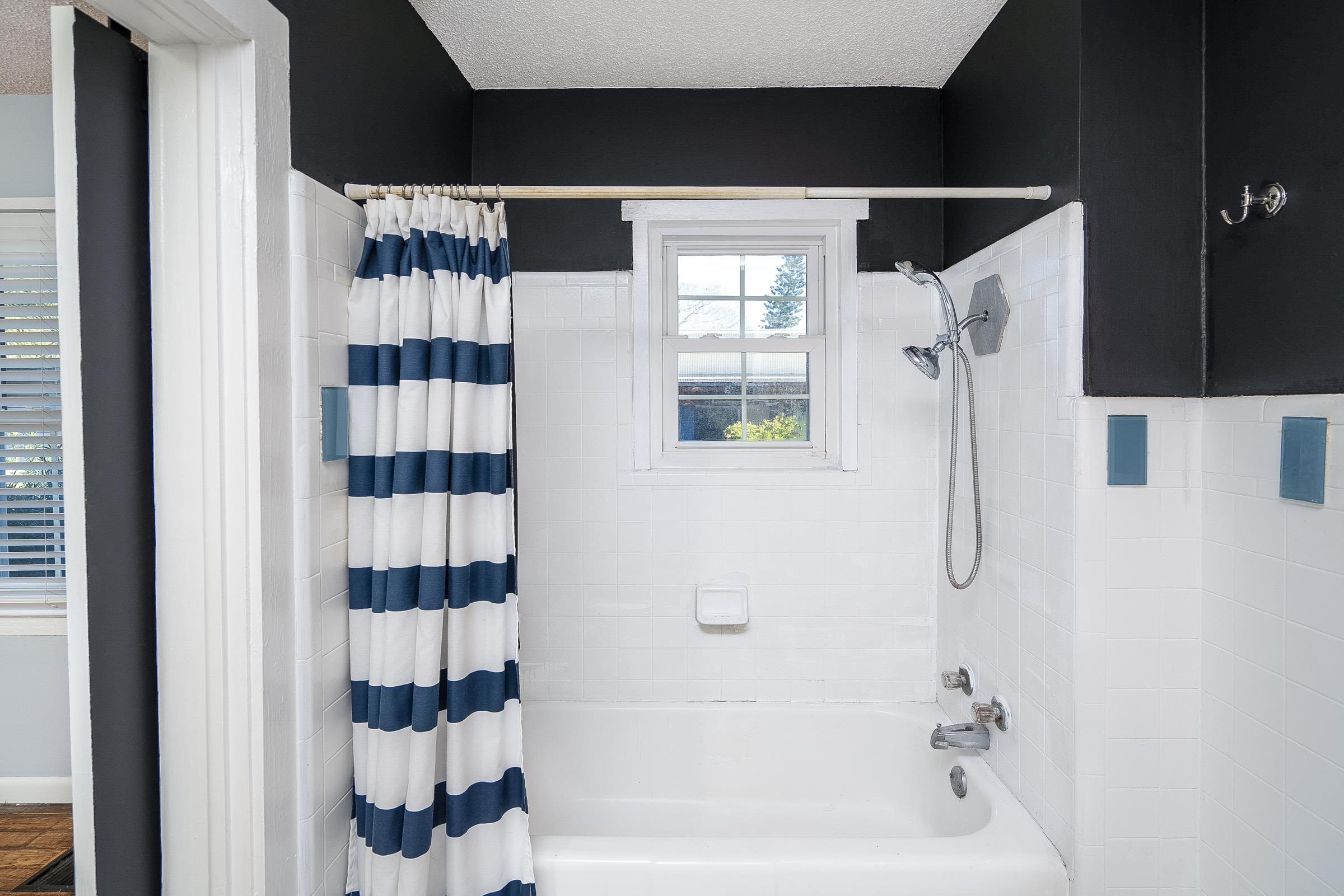 401 Zorayda Avenue St. Augustine, FL 32080 - Photo 27 of 41 a bathroom with a bathtub and a shower