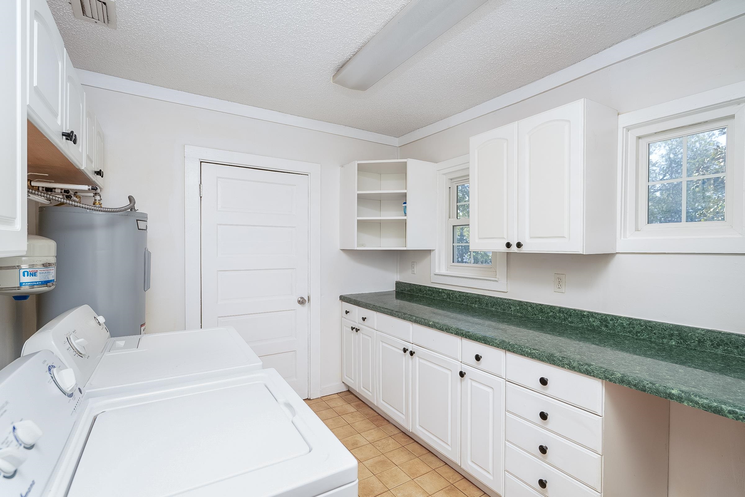 401 Zorayda Avenue St. Augustine, FL 32080 - Photo 29 of 41 a kitchen with a sink and cabinets