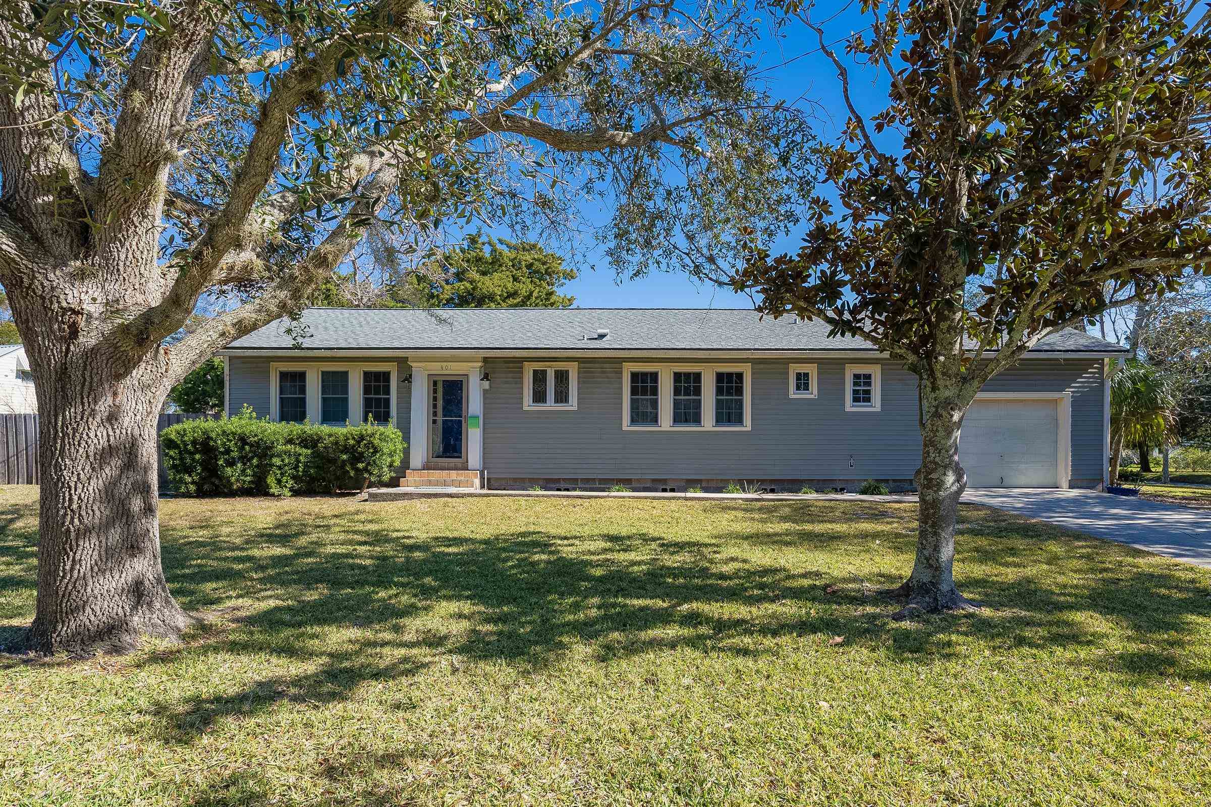 401 Zorayda Avenue St. Augustine, FL 32080 - Photo 3 of 41 a front view of a house with a yard