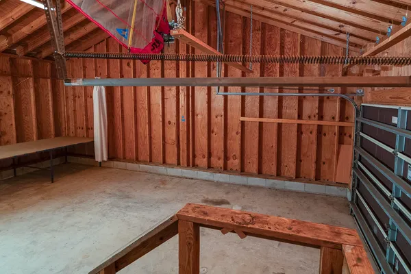 a view of walk in closet with clothes