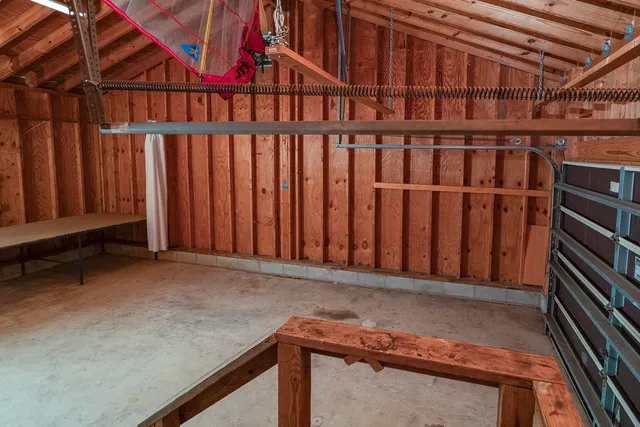 a view of walk in closet with clothes