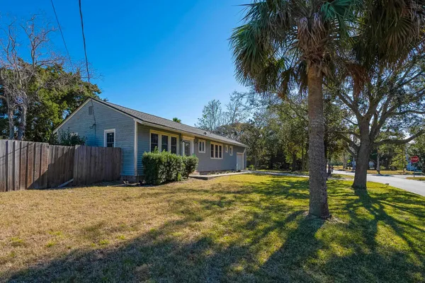 a view of a house with pool and trees