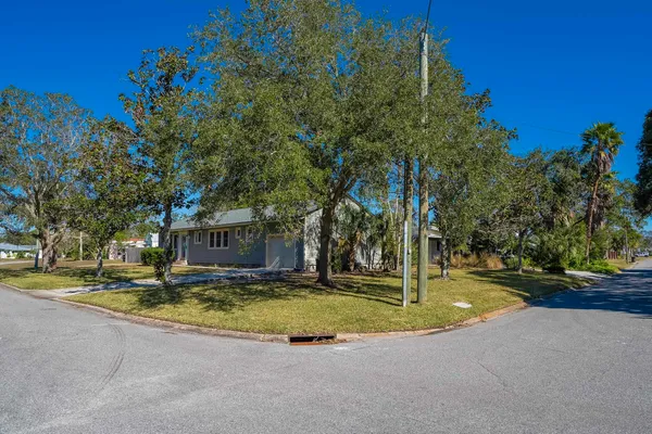 a view of a house with swimming pool and sitting area