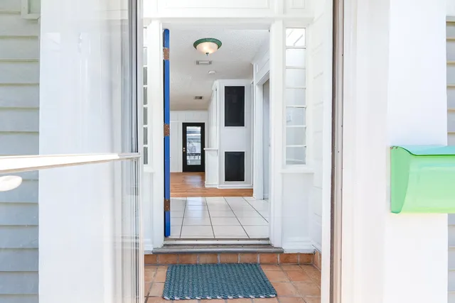 a view of a bedroom from a hallway