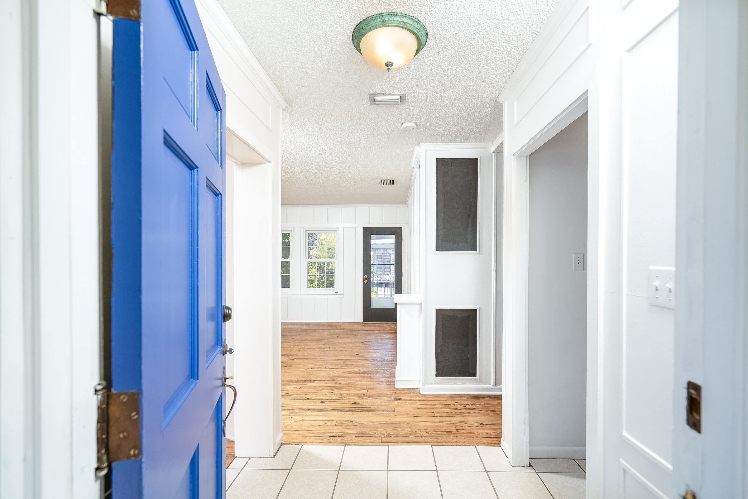 401 Zorayda Avenue St. Augustine, FL 32080 - Photo 6 of 41 a view of a hallway with windows and cabinet