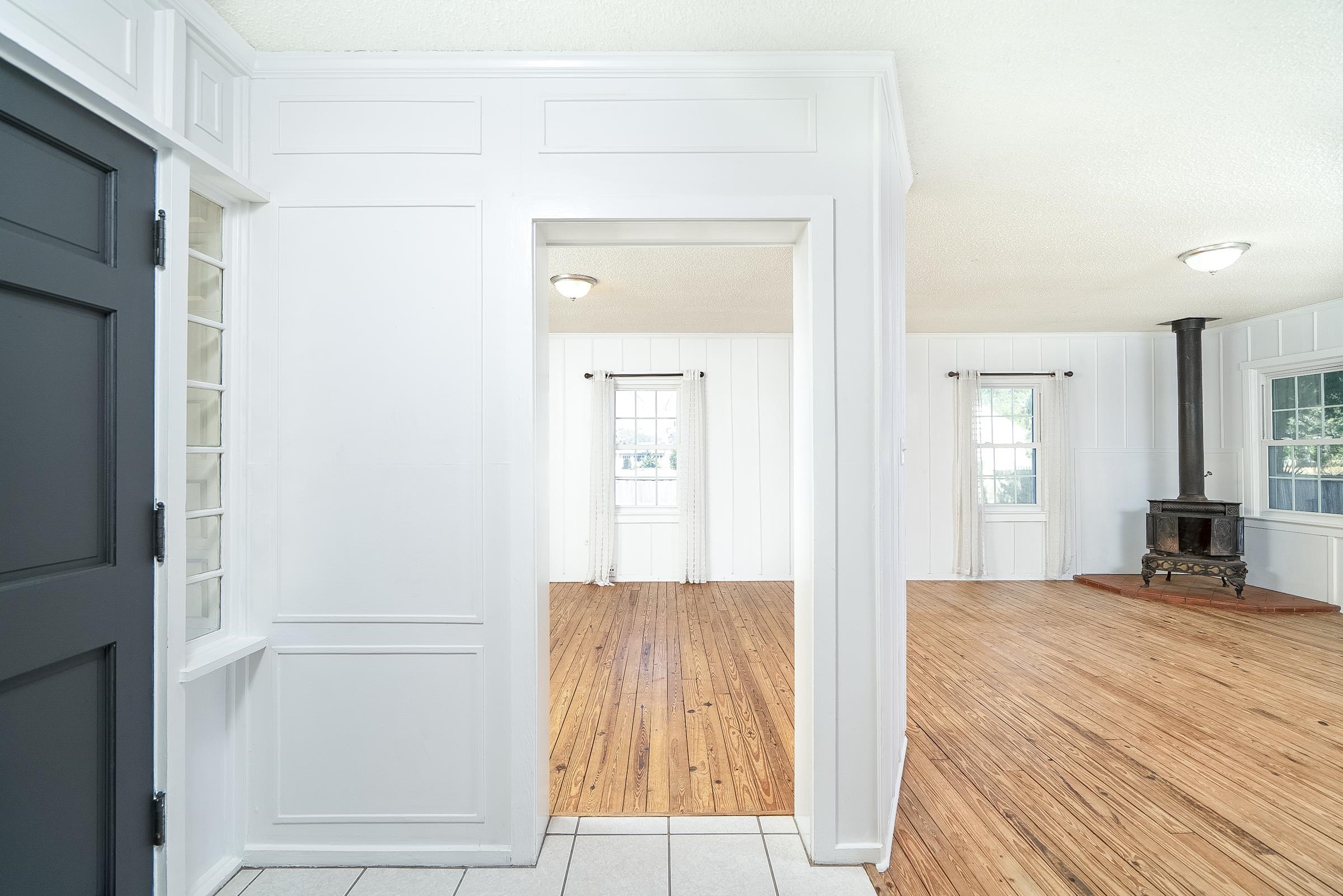401 Zorayda Avenue St. Augustine, FL 32080 - Photo 7 of 41 a view of a bedroom with wooden floor and windows