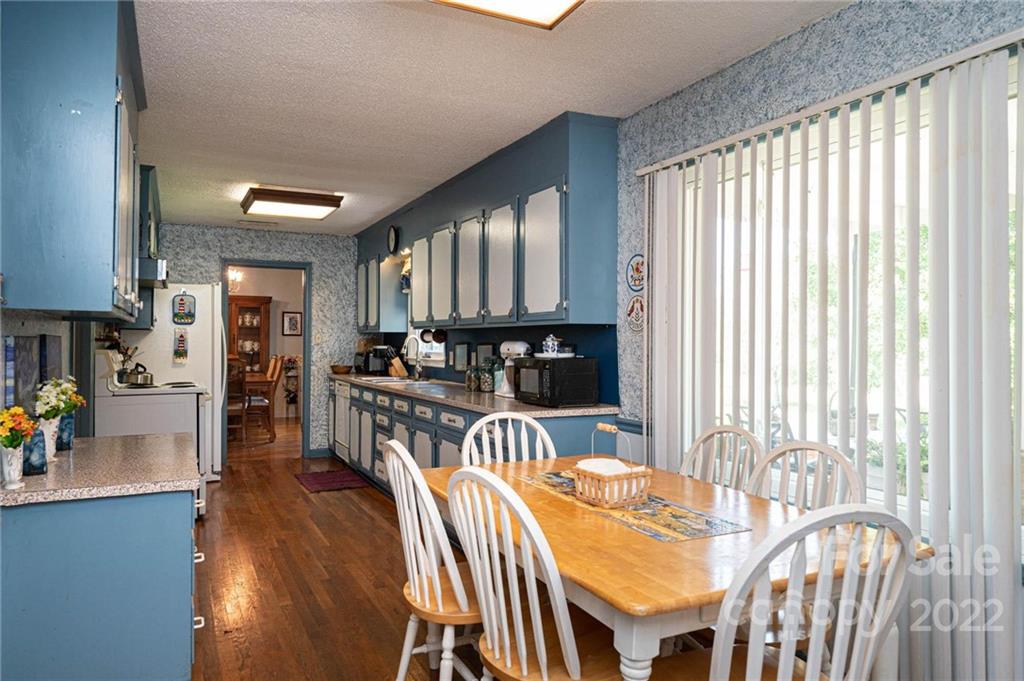 960 Perth Road Troutman, NC 28166 - Photo 23 of 48 a view of a dining room with furniture and a window