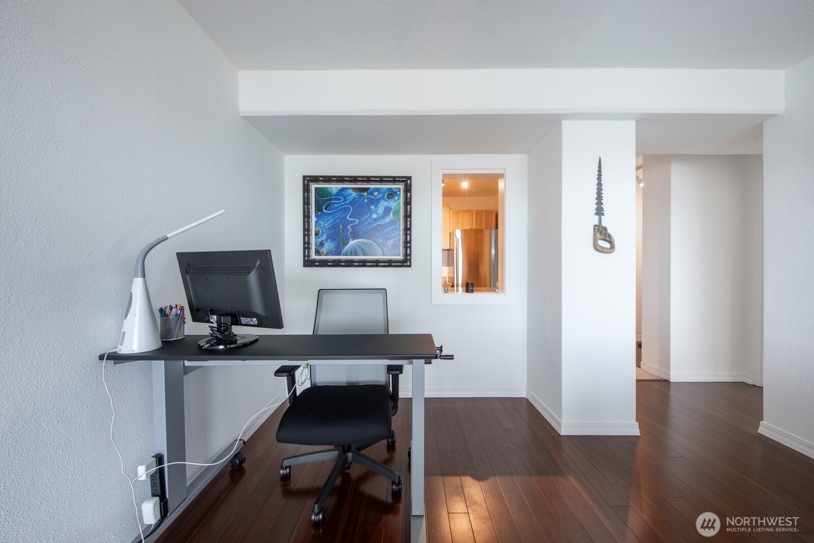 308 East Republican Street, Unit 508 Seattle, WA 98102 - Photo 11 of 27 a view of a workspace with furniture and wooden floor